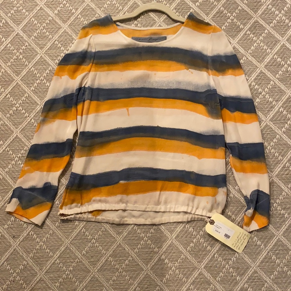 Hand painted silk shirt. Loose elastic at bottom